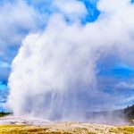 Eruption of the famous Old Faithful Geyser a Cone Geyser in the Upper Geyser Basin along the Continental Divide Trail in Yellowstone National Park, Wyoming, United States