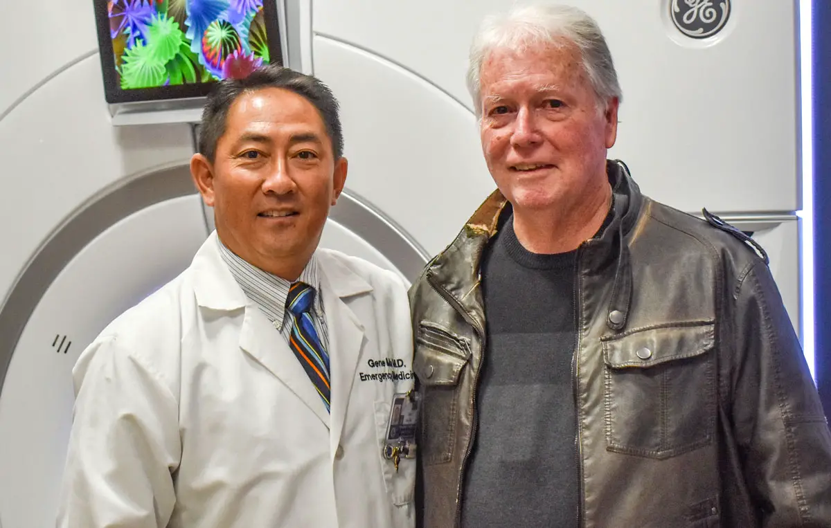 Dr. Gene Ma, an emergency room physician at Tri-City Medical Center, stands next to Larry Hull, an Oceanside resident whose life was saved thanks to Tri-City’s Stroke Care Center team.