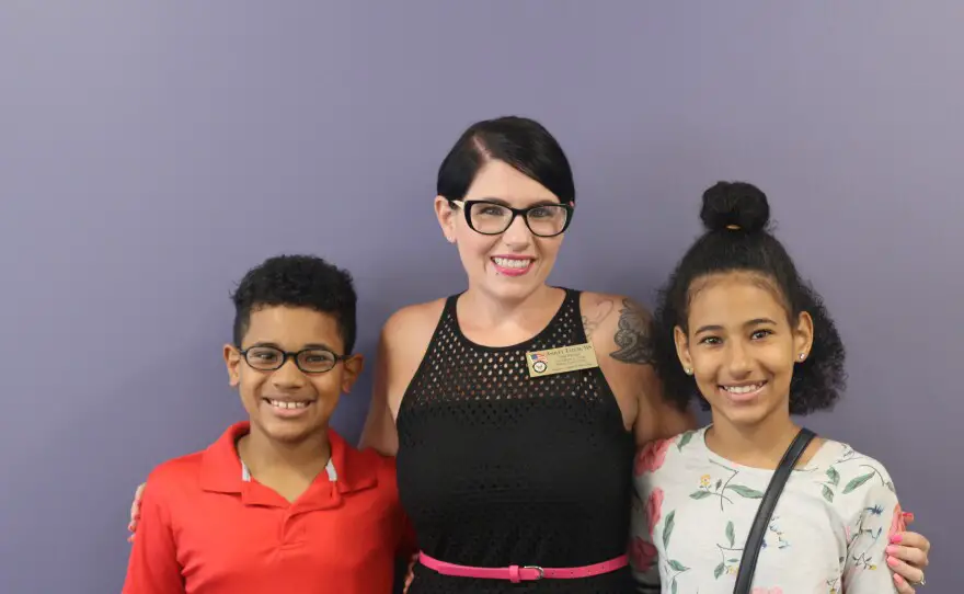 Navy veteran Ashley Tatum, center, with her children Tj and Taylor at the Steven A. Cohen Military Family Clinic at Veterans Village of San Diego.