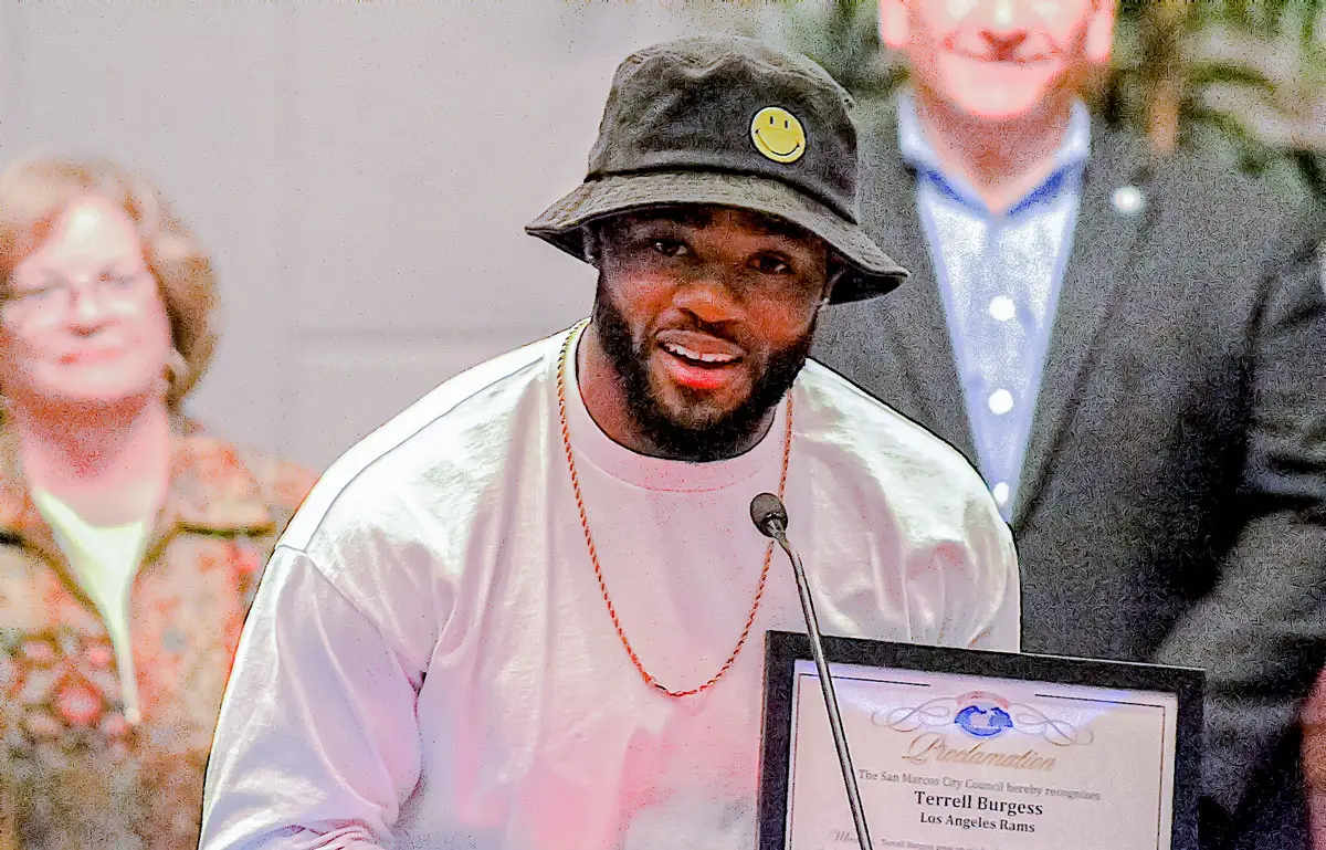Terrell Burgess, a San Marcos High School alum and current Los Angeles Rams safety, receives a proclamation from Mayor Rebecca Jones during a Feb. 22 San Marcos City Council meeting.
