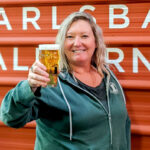 Melody Campbell, culture and events manager at Carlsbad's Burgeon Beer, toasts a blond ale.