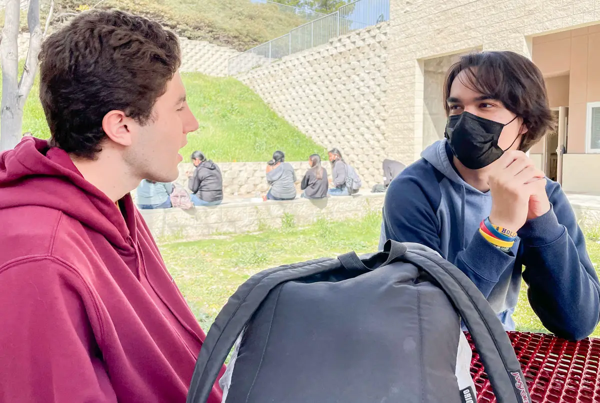 Brennan Ortega, left, and Joey Pena, two seniors at Mission Hills High School chat during a break at school. While students have returned to in-person classes, the district's enrollment and attendance numbers are down.