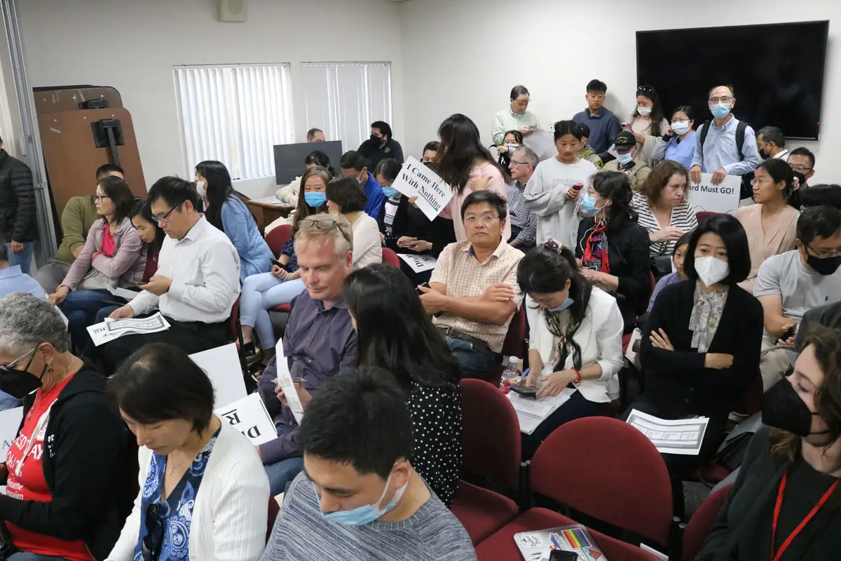 Hundreds of community members, largely from the district's Chinese American community, fill the San Dieguito Union School District board room and two overflow rooms on Wednesday to protest comments about Chinese families in the district made by Superintendent Dr. Cheryl James Ward.