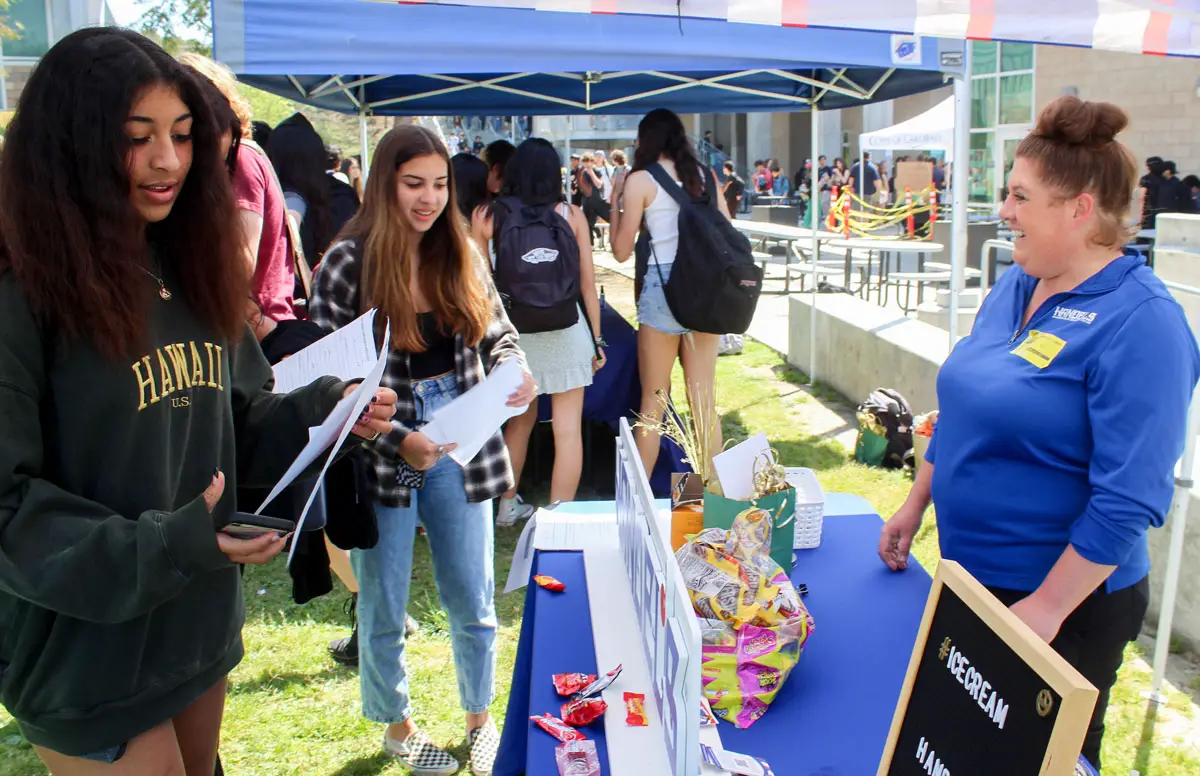 Shawnta Fleming of Handle’s Ice Cream in Carlsbad speaks with students at Sage Creek High School on April 7 during the school’s Jobs, Internship, Vocational and Educational (JIVE) expo.