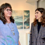 Multimedia artist Leena Hannonen, left, is pictured at her exhibition "Poseidon's Garden" at Solana Beach City Hall with Kayla Moshki, staff liaison for the city's Public Arts Commission.