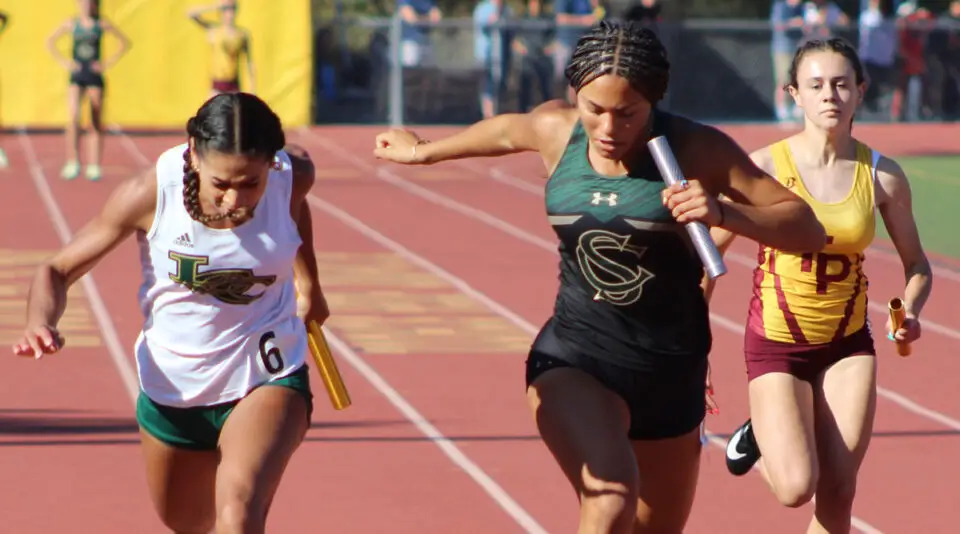 Sage Creek senior Lizzie Hatton finishes the anchor leg of the 4x100-meter race during the May 6 Coastal League Finals at El Camino High School in Oceanside. Photo by Steve Puterski