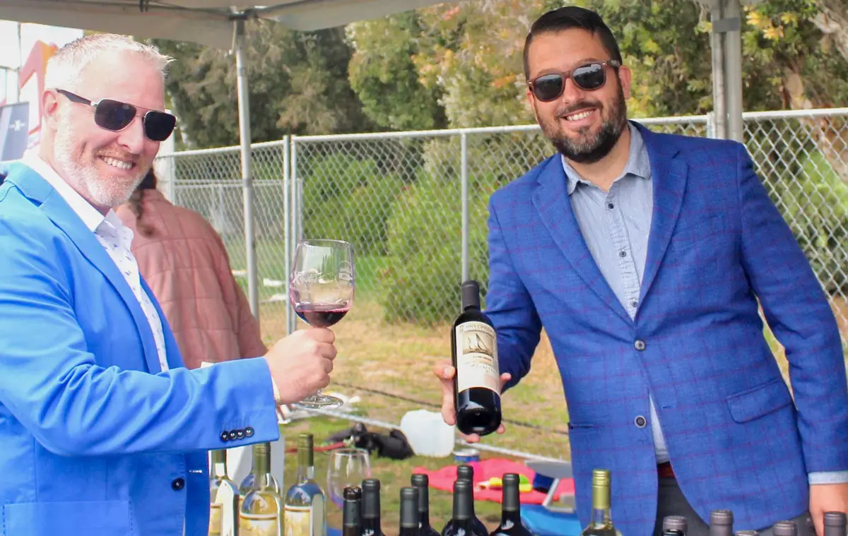 Joe Czesnakowicz (right), regional sales manager for Dry Creek Vineyard, pours a 2019 zinfandel to a pleased guest at the California Wine Festival in Carlsbad. Photo by Rico Cassoni
