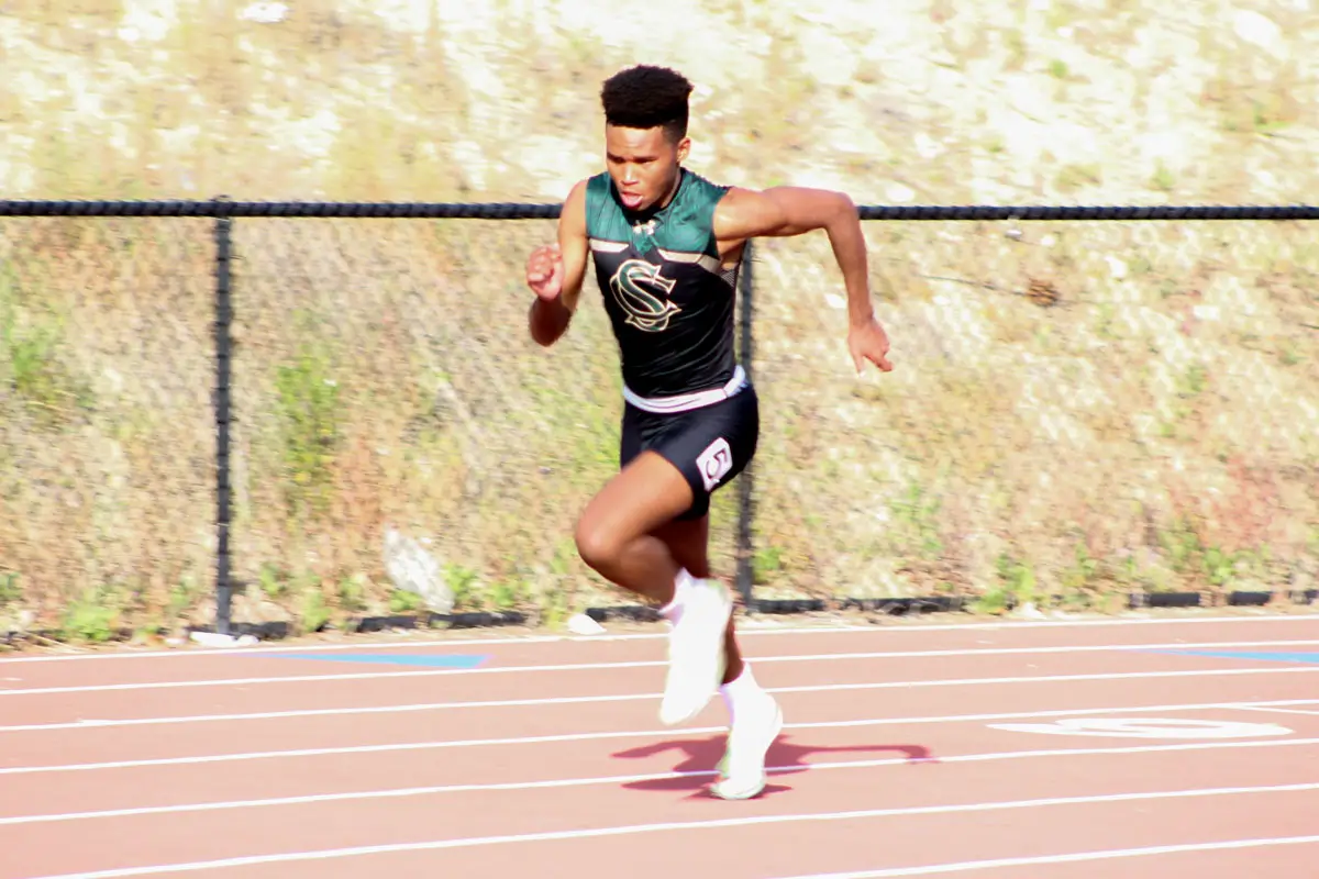 Brian Maweu-Smalls, a junior at Sage Creek High School in Carlsbad, runs the 400-meter race during a meet in April. Maweu-Smalls will run in the 800 and 4x400 relay for the Bobcats during this week’s CIF preliminary meet. Photo by Steve Puterski