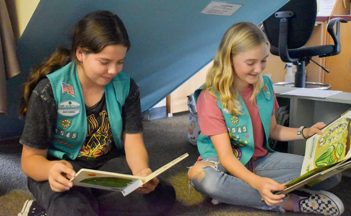 Maddie Phelps and Kiara Sottile are both fifth graders and members of Girl Scout Troop 1545. The girls along with their fellow troop members created the Butterfly Corner, a new exhibit at the Buena Vista Lagoon Nature Center. Photo by Samantha Nelson