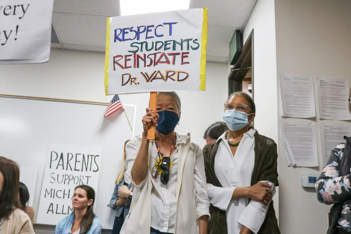 A community member advocates for the reinstatement of San Dieguito Union High School District Superintendent Dr. Cheryl James-Ward, who was placed on administrative leave in April after her comments about the Chinese community drew backlash. Photo by Laura Place