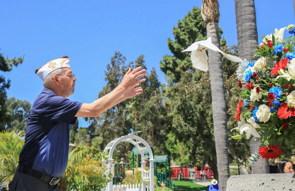 Randy Treadaway, a member of VFW Post 5431, leads a dove release during the annual Memorial Day ceremony on Monday at La Colonia Park in Solana Beach. Photo by Laura Place
