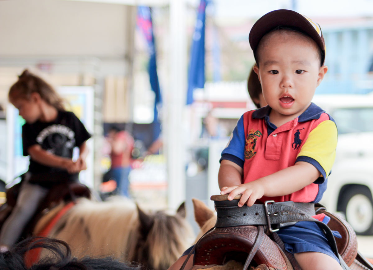 Little ones enjoy pony rides at the 2022 San Diego County Fair, located at the Del Mar Fairgrounds. Photo by Laura Place