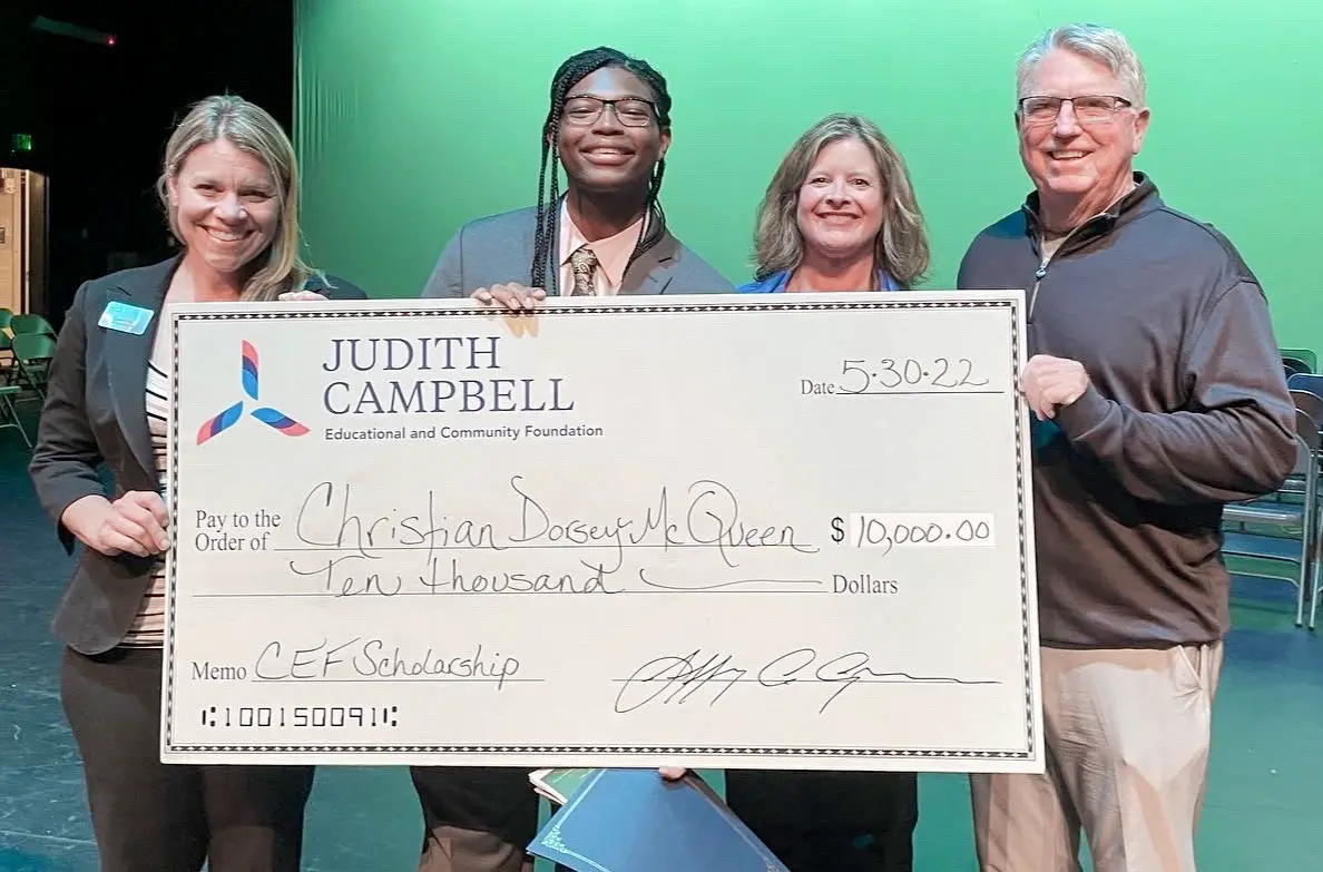 Christian Dorsey-McQueen, a graduate of Sage Creek High School, second from left, was awarded a $10,000 scholarship from the Judith Campbell Family and Community Foundation. Also pictured from left are Laura Pitts of the Carlsbad Educational Foundation and Linda and Jeff Campbell. Courtesy photo