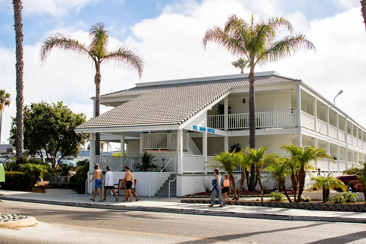 Del Mar residents pass by the remodeled Del Mar Beach Hotel on Coast Boulevard in mid-June. The city saw hotel tax revenue recover from COVID-19 impacts faster than expected over the past year. Photo by Laura Place