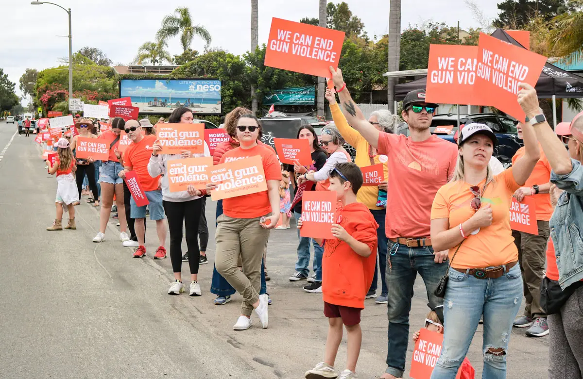Over 100 residents attended an annual Wear Orange gun safety demonstration along North Coast Highway 101 in Encinitas on Saturday, organized by North County Moms Demand Action. Photo by Laura Place