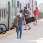 Passengers board the train on July 18 at the Carlsbad Poinsettia Coaster Station. Photo by Steve Puterski