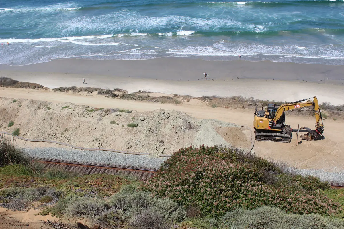 Heavy machinery sits idle along the train tracks on July 1 in Del Mar. The San Diego Association of Governments is set to apply and receive $300 million from the state to address realigning the Del Mar train tracks off the bluff and tunnel through the city. Photo by Steve Puterski