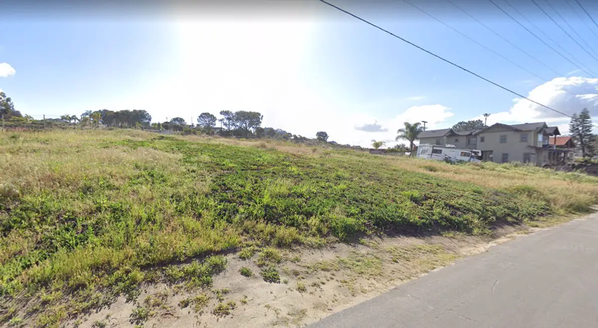 The eight-unit Ida Avenue apartment project approved by the Solana Beach City Council this month will be constructed upon a vacant lot, pictured, on the east side of Ida south of Genevieve Avenue, with Interstate 5 directly to the west. Courtesy photo 