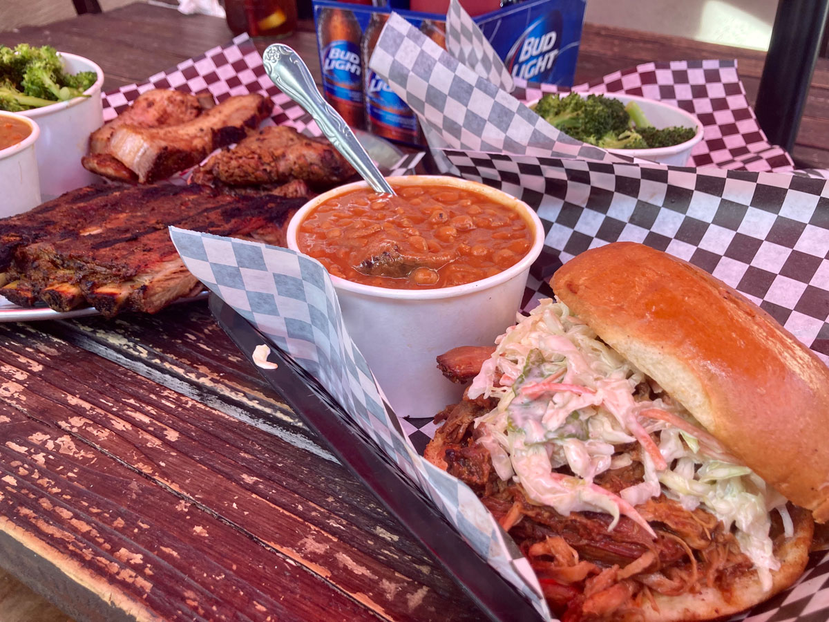 The Pulled Pork sandwich with coleslaw and the sampler platter at Up in Smoke. Photo by David Boylan