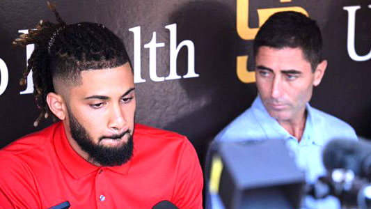 Fernando Tatis Jr., left, speaks to the media on Tuesday, with Padres GM A.J. Preller looking on. Photo via Twitter