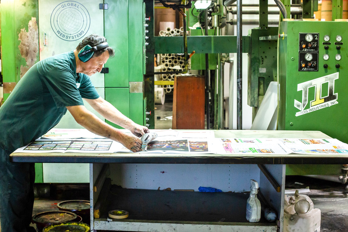 San Diego Printing press: A printing press operator at Advanced Web Offset in Vista. File photo/Shana Thompson
