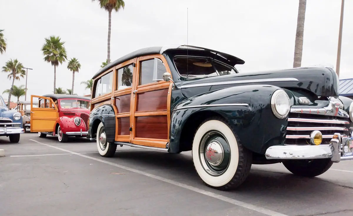 Two woodies in the Moonlight Beach parking lot on Saturday, Sept. 17 at the Wavecrest Woodie Meet at Moonlight Beach in Encinitas. Photo by Jacqueline Covey