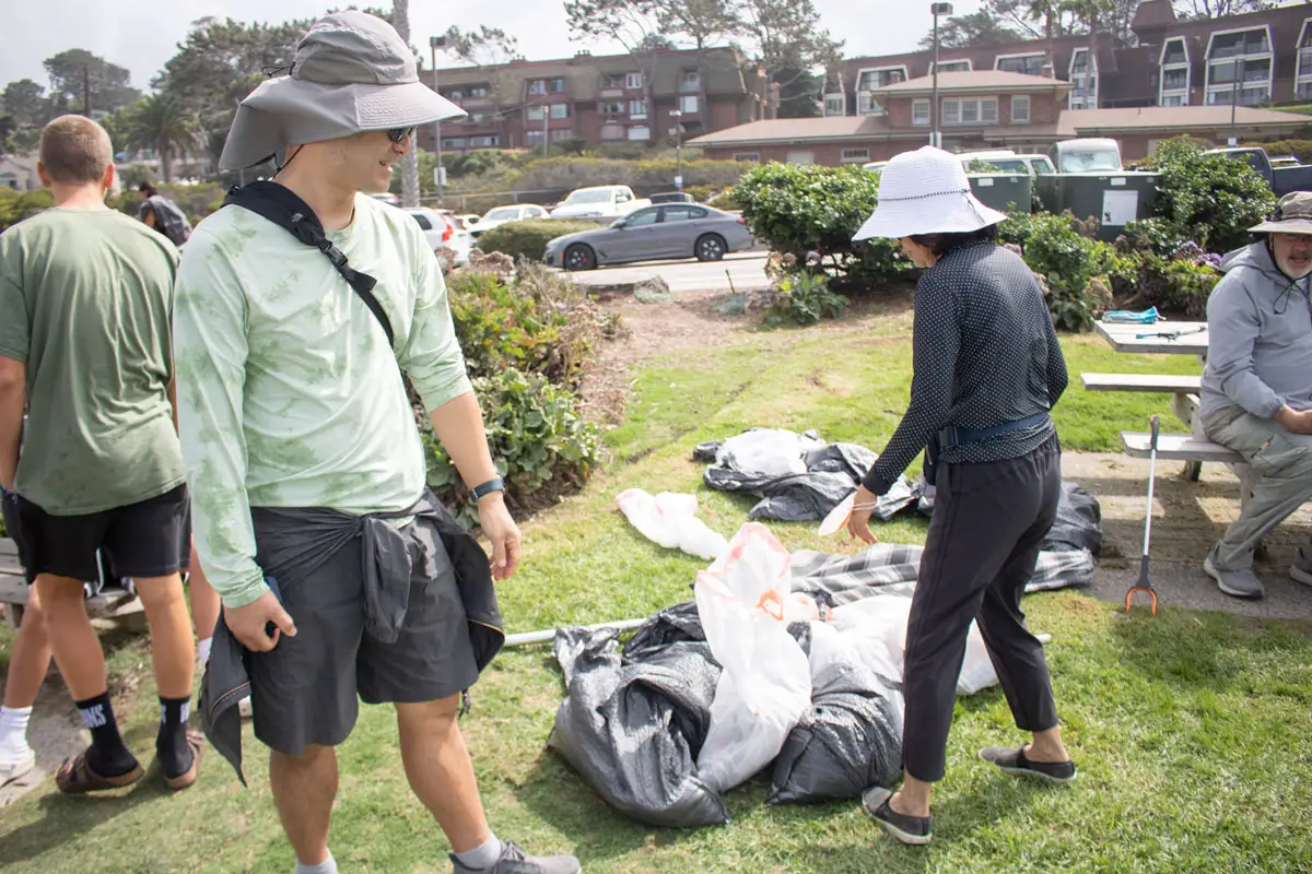 Community members drop off bags of trash collected on the beach in Del Mar during the 38th annual Coastal Cleanup Day on Saturday. Cleanup efforts took place at over 70 sites throughout San Diego County. Photo by Laura Place