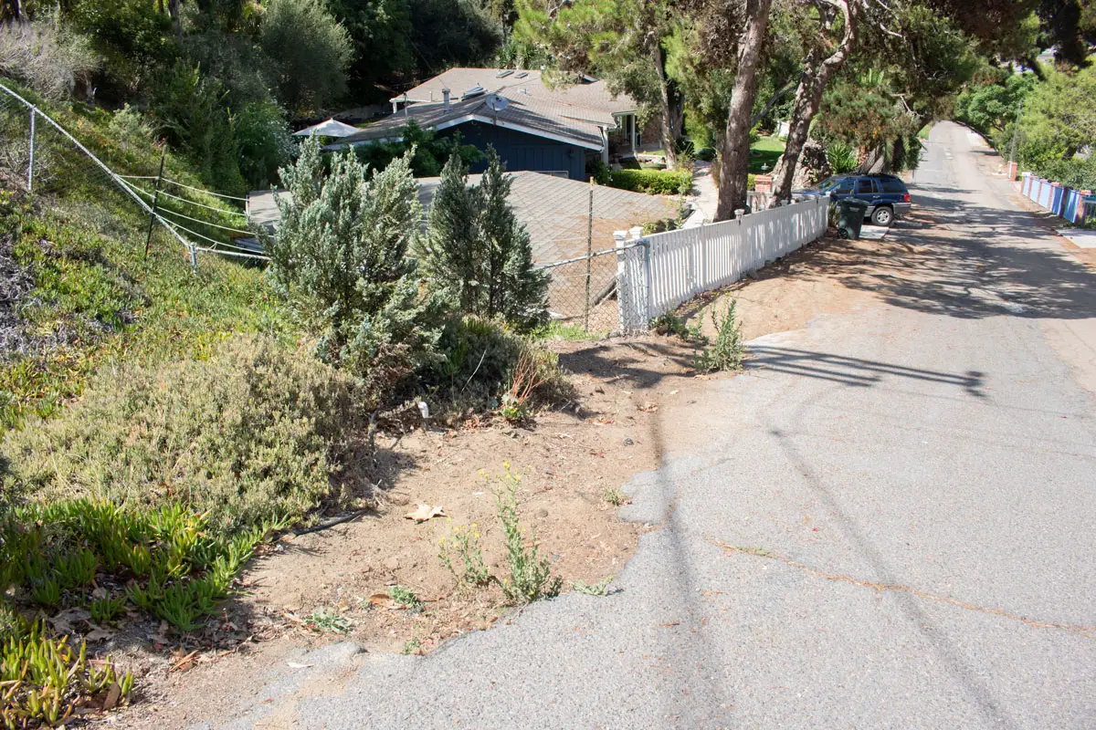 Portions of San Dieguito Drive near Oribia Road have deteriorated over the years. Photo by Laura Place