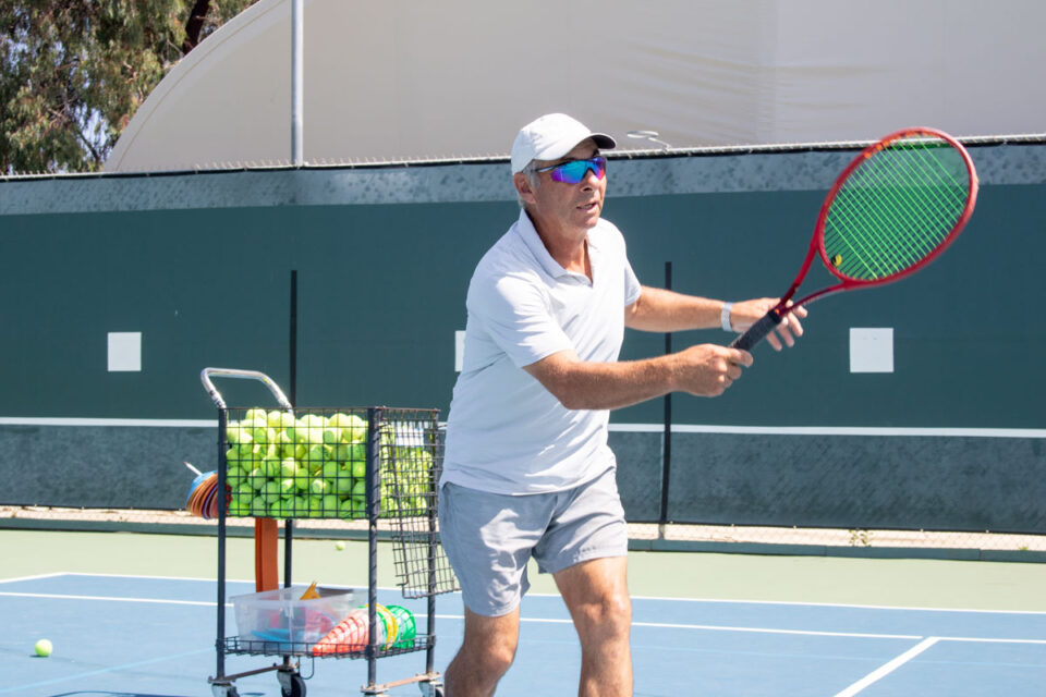 Private tennis coach Andrey Portnoy conducts a lesson at the Surf & Turf Tennis Club on Sunday in Del Mar. Photo by Laura Place