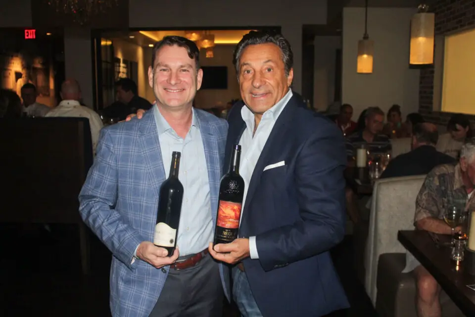 Alan Crawford, vice president of the Foley Family of Wines, left, and Flora owner Sal Ercolano, who holds the richly-textured Ferrari-Carano Tresor. Photo by Frank Mangio