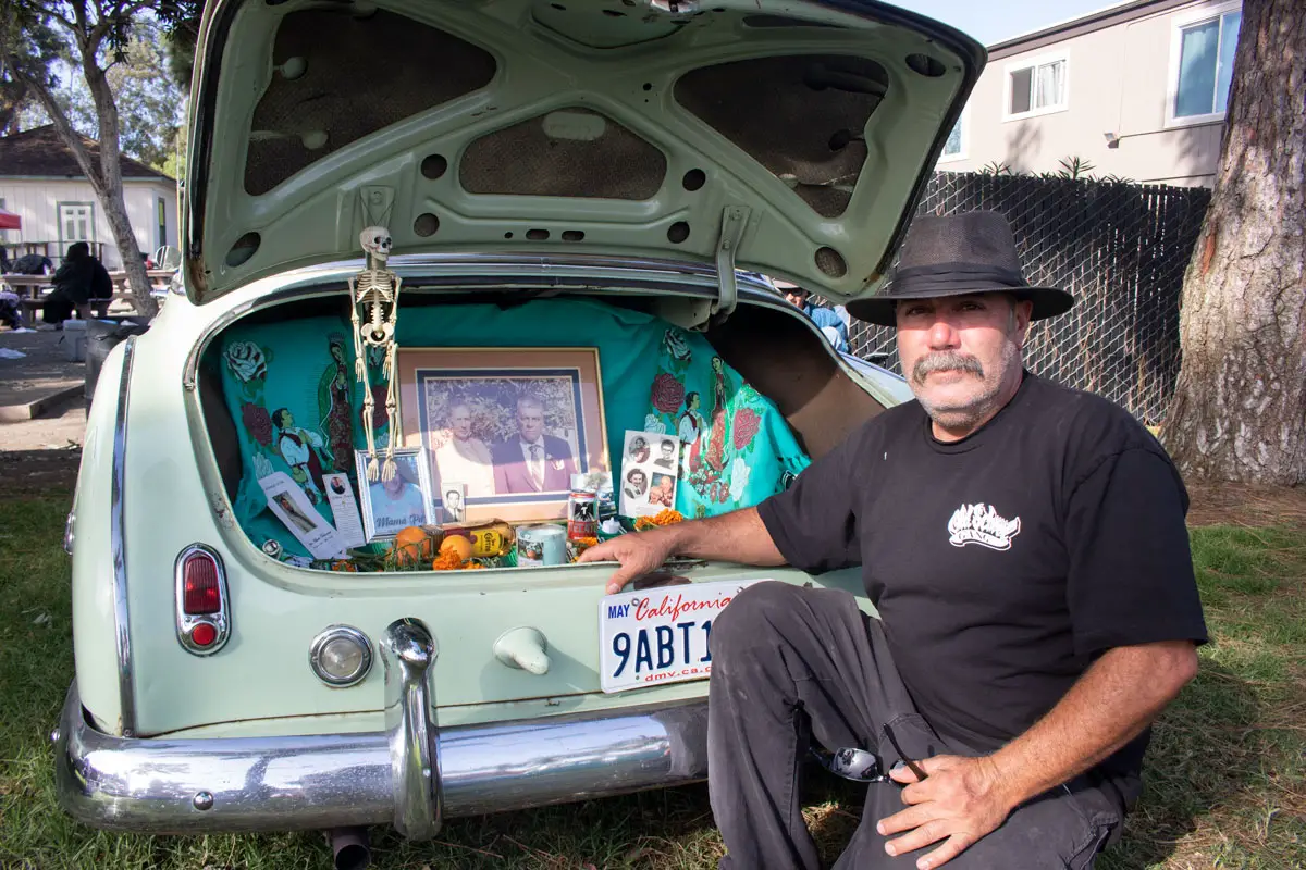 Jose Vega, of Oceanside, created an ofrenda in the trunk of his 1950 Chevy for the Día de los Muertos celebration on Oct. 23 at La Colonia Community Park in Solana Beach. Photo by Laura Place