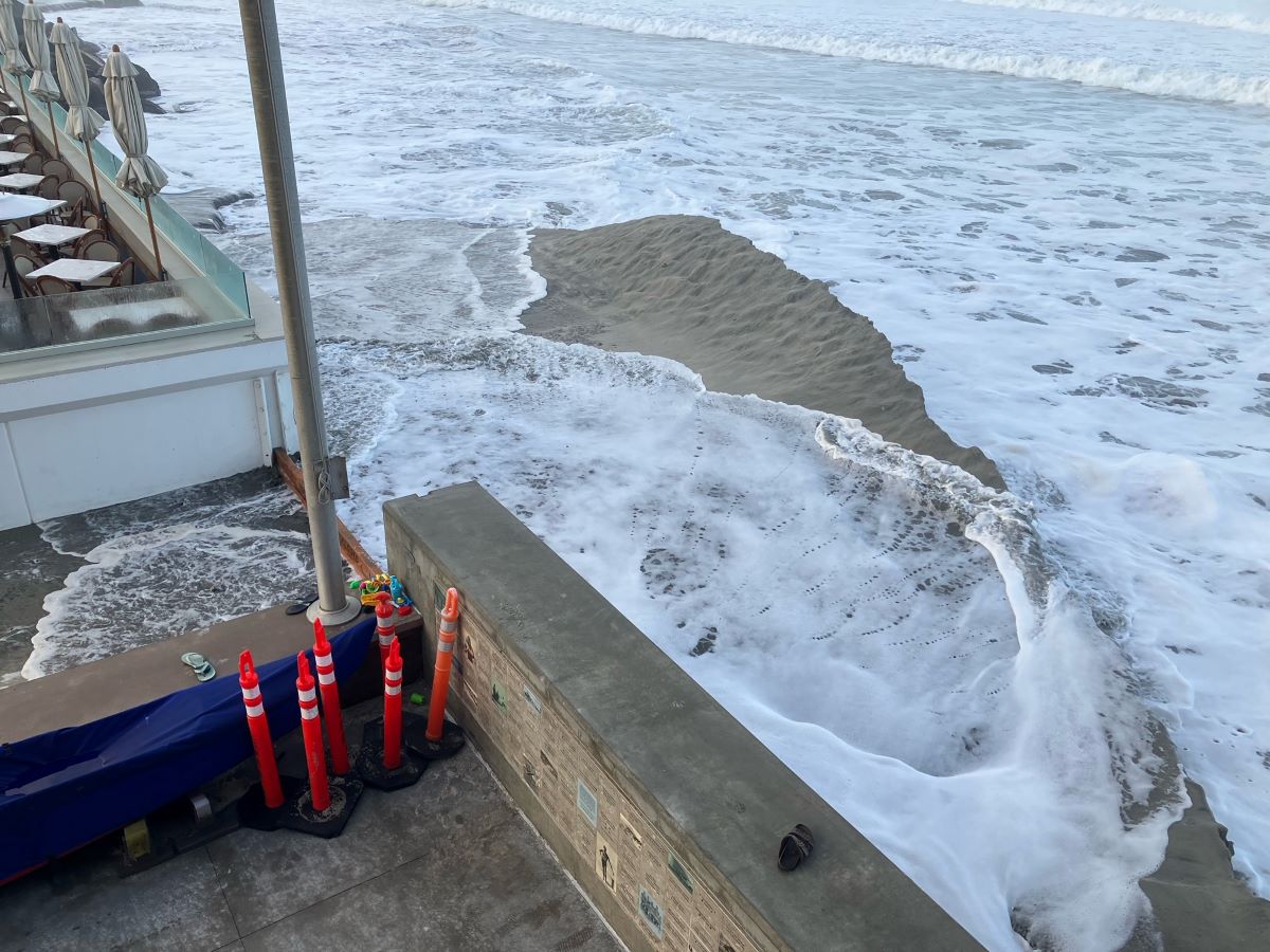 High tide and large waves as the result of a winter storm wash away sand berms and flood areas of the Del Mar Lifeguard Headquarters on Friday. Photo courtesy of City of Del Mar 