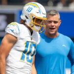 Chargers star quarterback Justin Herbert with former offensive coordinator Joe Lombardi, who was released Tuesday. Photo via Twitter/NFL