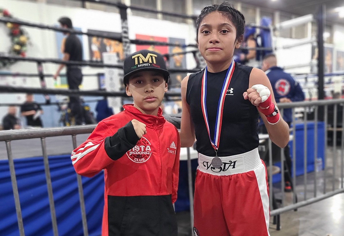 Vista residents Victor Villagomez, 10, left, and Uleena Torres, 13, at the Silver Gloves Region 8 Championships earlier this month in Compton. Photo by Rudy Moreno 
