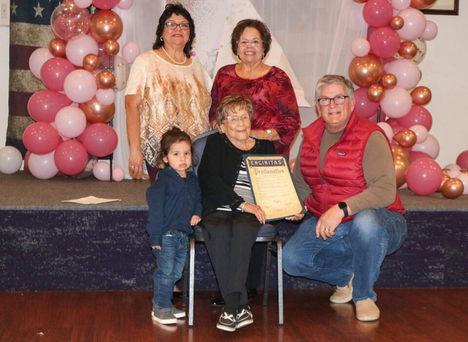 Simona Montes Gonzalez, center, receives a proclamation from the city of Encinitas honoring her 95th birthday alongside Mayor Tony Kranz, right, daughters Rachel and Priscilla, back center and left, and great-grandson Roman. Photo by Laura Place