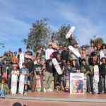 Community members hold up their skateboards in honor of Tyre Nichols on Saturday at Encinitas Skate Plaza. Photo by Laura Place