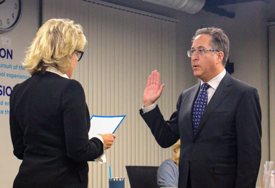 Alan Kholos is sworn in as the newest trustee on the Del Mar Union School District board by Superintendent Holly McClurg during an April 11 meeting. Photo by Laura Place