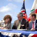 Solana Beach Mayor Lesa Heebner signs a partnership agreement for the USACE Coastal Storm Damage Reduction Project alongside Encinitas Mayor Tony Kanz and Rep. Mike Levin. Photo by Laura Place