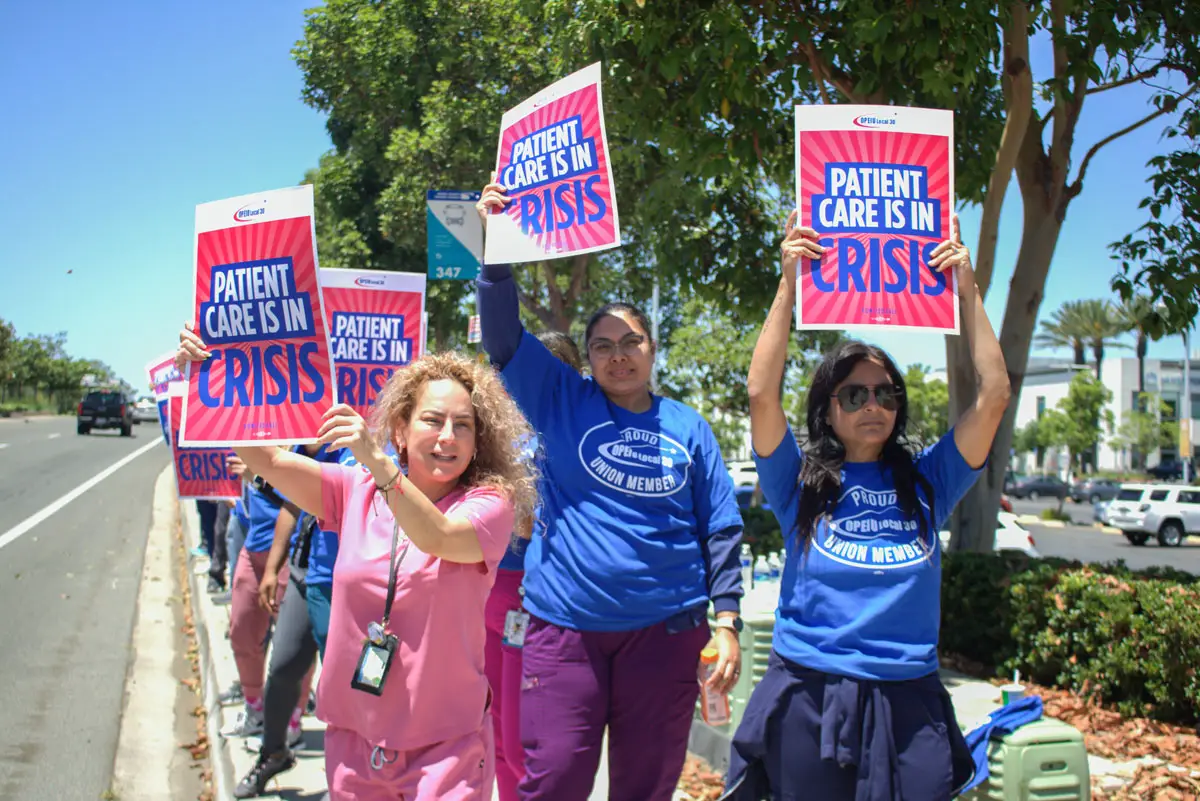 Kaiser healthcare workers participate in a demonstration by OPEIU Local 30  on July 26 outside of the new San Marcos Kaiser hospital on Craven Road. Photo by Laura Place