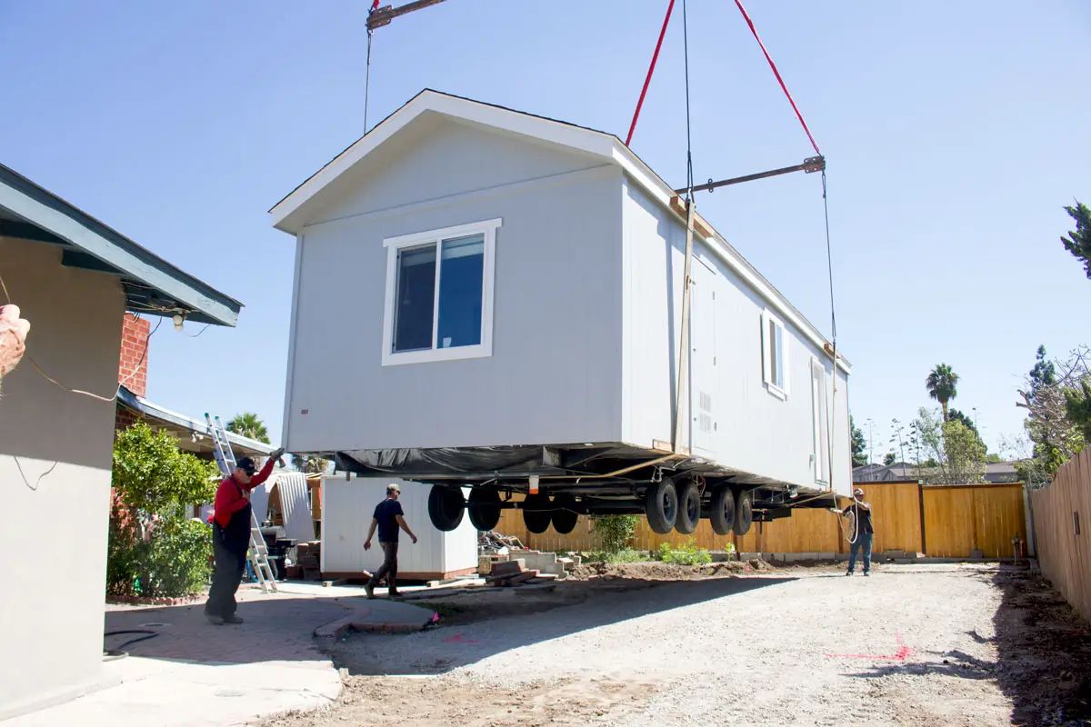 A prefabricated accessory dwelling unit is installed on Sept. 19 in a Vista backyard. Solana Beach is looking to change regulations to better facilitate the construction of ADUs. Photo by Laura Place