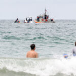 The Coast Guard, Border Patrol and local lifeguards respond to a disabled vessel on Aug. 10 floating off the Solana Beach coast. Photo by Joe Orellana