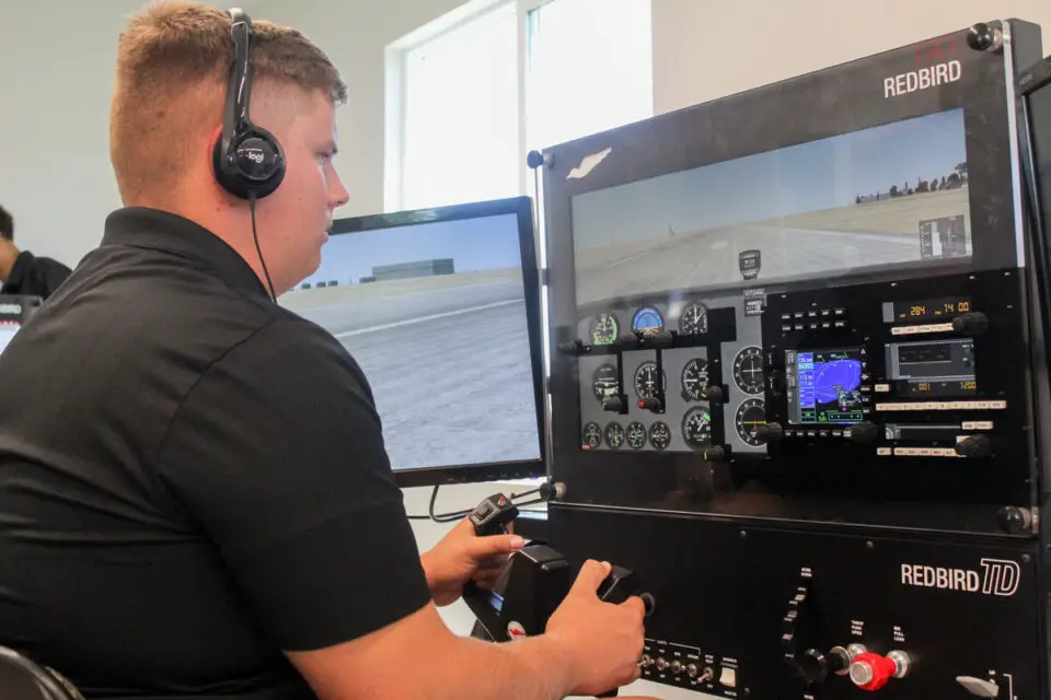 Army and Navy Academy junior Cadet Kelly McKinley operates a Redbird flight simulator on Aug. 22 in the aviation lab at the school's new Fitzgerald Innovation Center. Photo by Steve Puterski