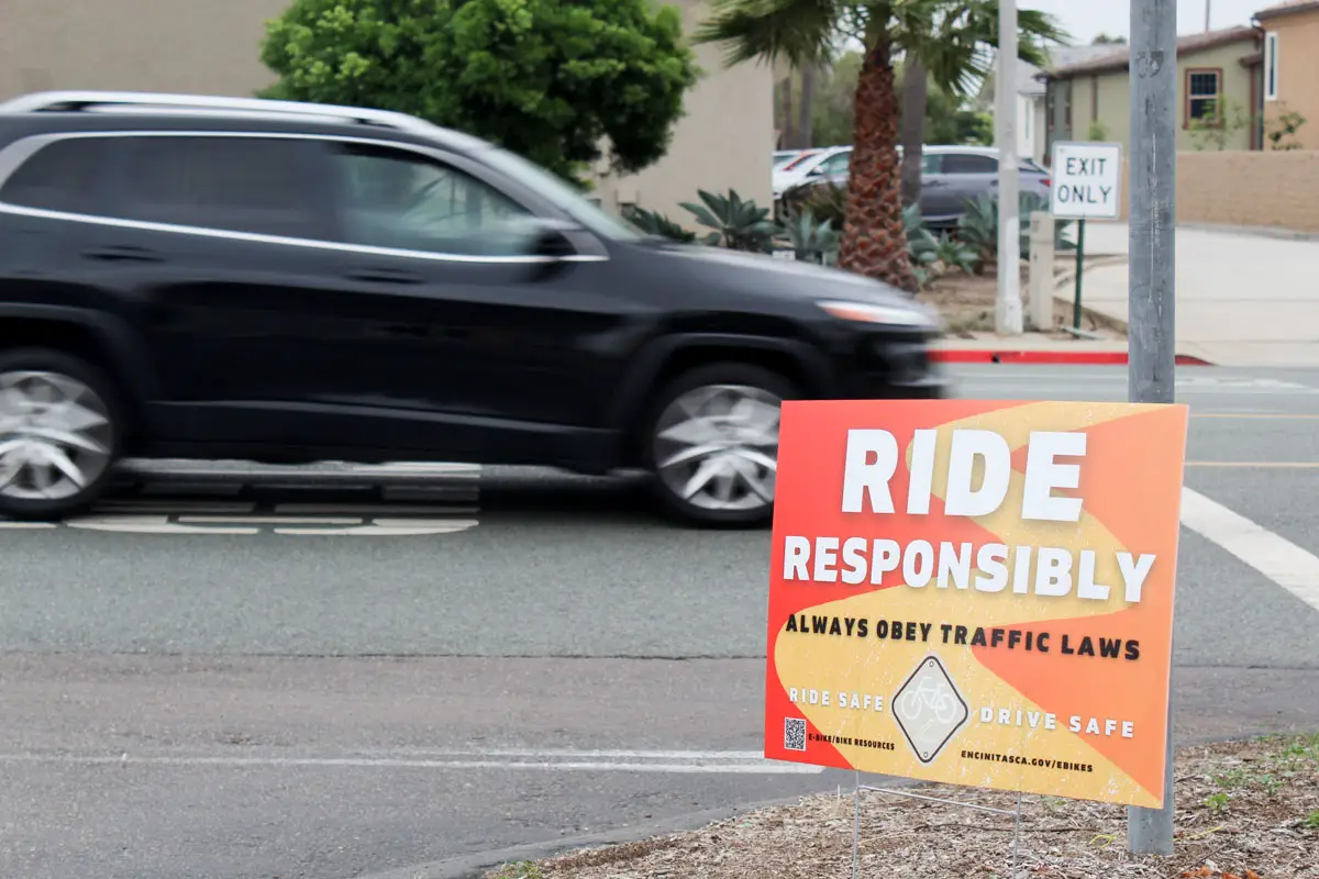 Signs advising safe cycling can be seen outside San Dieguito Academy on Sept. 21. Photo by Laura Place