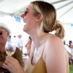 Kate Abudayyeh enjoys a laugh with friends at the Del Mar Wine and Food Festival on Sunday at Surf Cup Sports Park. Photo by Laura Place