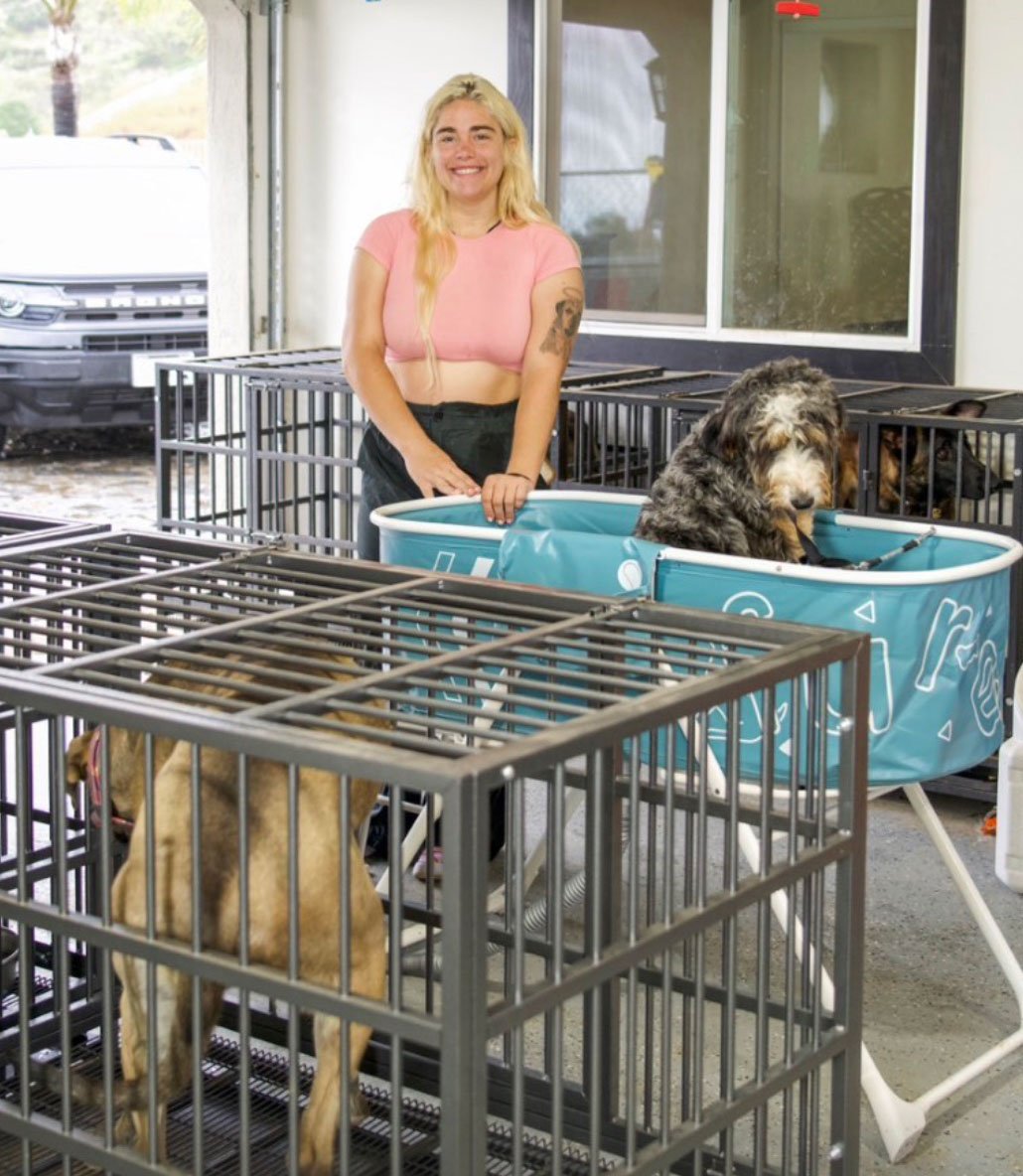 Lauren Russell in her garage, where she would keep dozens of dogs in her fraudulent dog boarding and training business. Photo from Perfect Pups Ohana Exposed