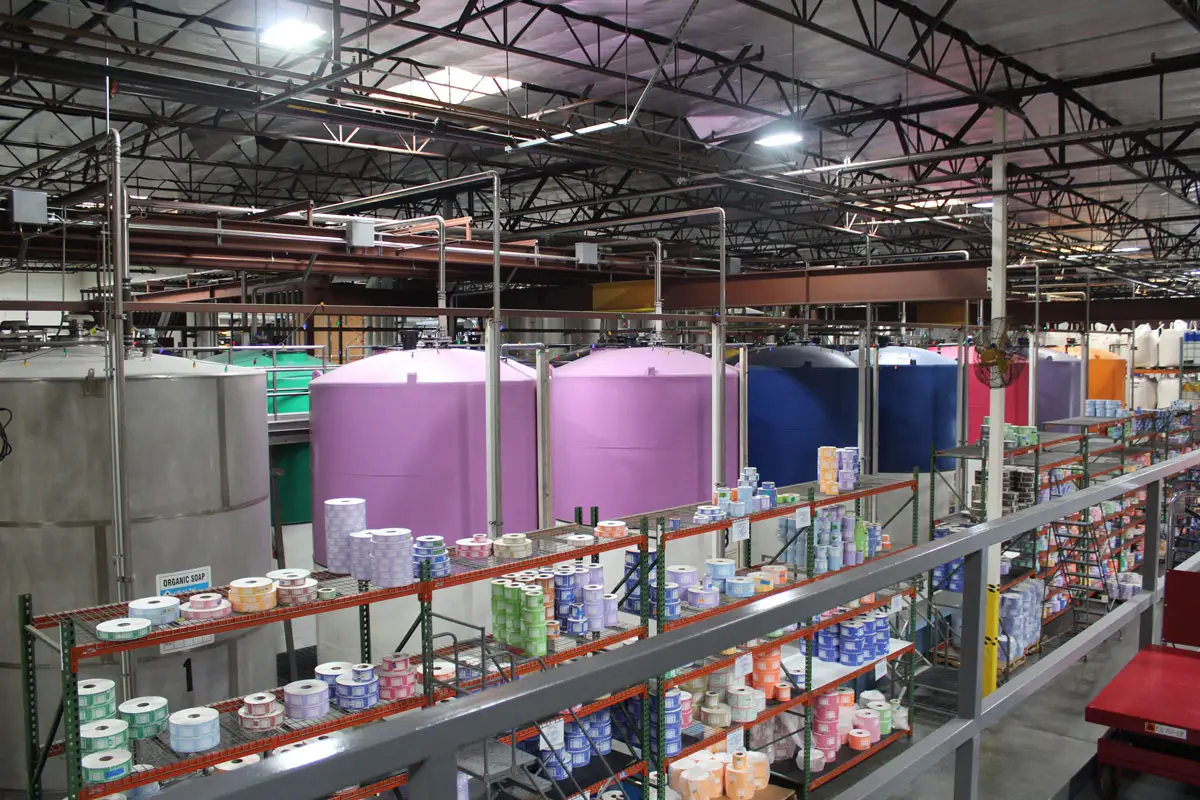 The Dr. Bronner’s Magic Soaps factory in Vista contains large tanks holding different scents of completed liquid soap. Purple indicates lavender, dark blue is peppermint, and so on. Photo by Laura Place