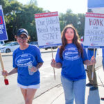 Kaiser Permanente medical assistants Maria Magana, right, and Josie Arias participate in a strike outside of San Marcos Medical Center on Oct. 5 Photo by Laura Place