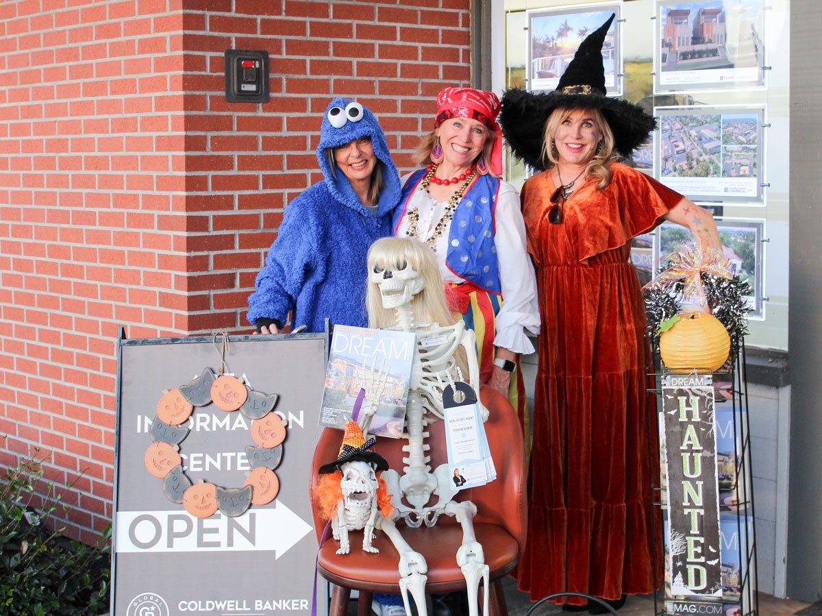 Laure Olsen, Terri Fox and Luchienne Lastovic have dished out candy outside of Coldwell Banker West for years. Photo by Abigail Sourwine