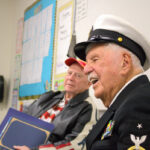U.S. Navy veterans Noel Durkin, right, and Peter McBride answer questions from Baypoint Preparatory Academy students on Nov. 17. Photo by Laura Place
