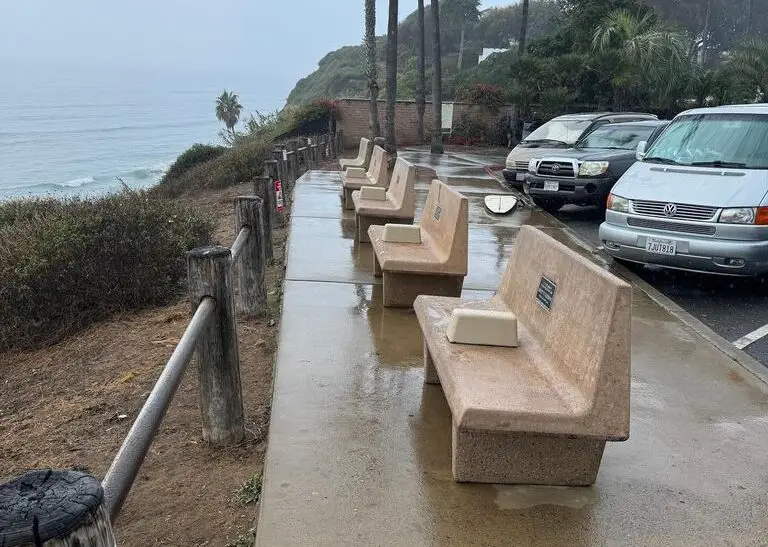 Benches removed from Swami's beach last week were returned with new cement dividers on Thursday, as shown in this photo shared by Encinitas Deputy Mayor Joy Lyndes on Facebook, following what the city said was regular maintenance. Photo via Facebook